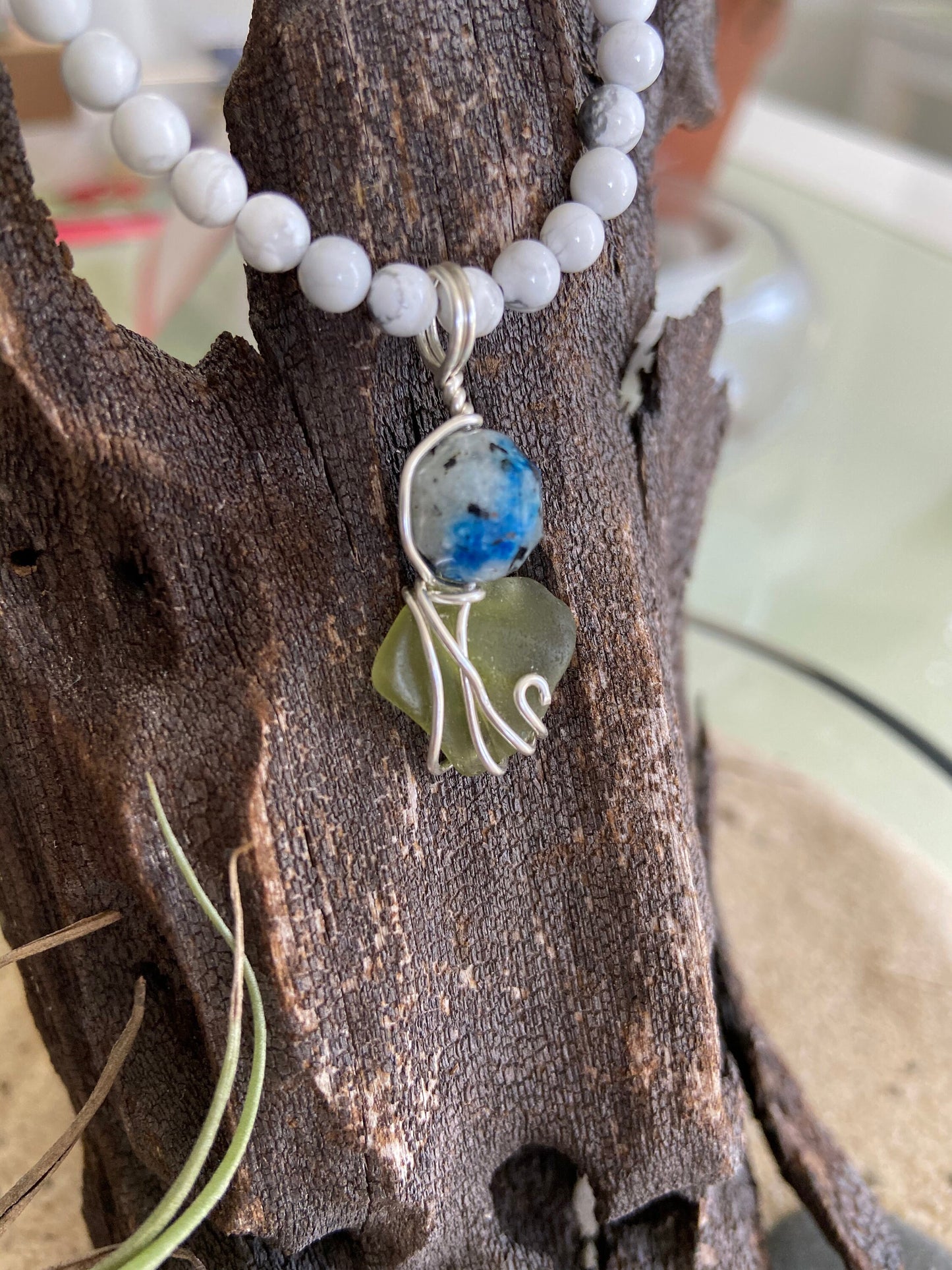 K2 crystal stone and Sea Glass intertwined in solid sterling silver to create a wonderful unique pendant with beautiful energies.