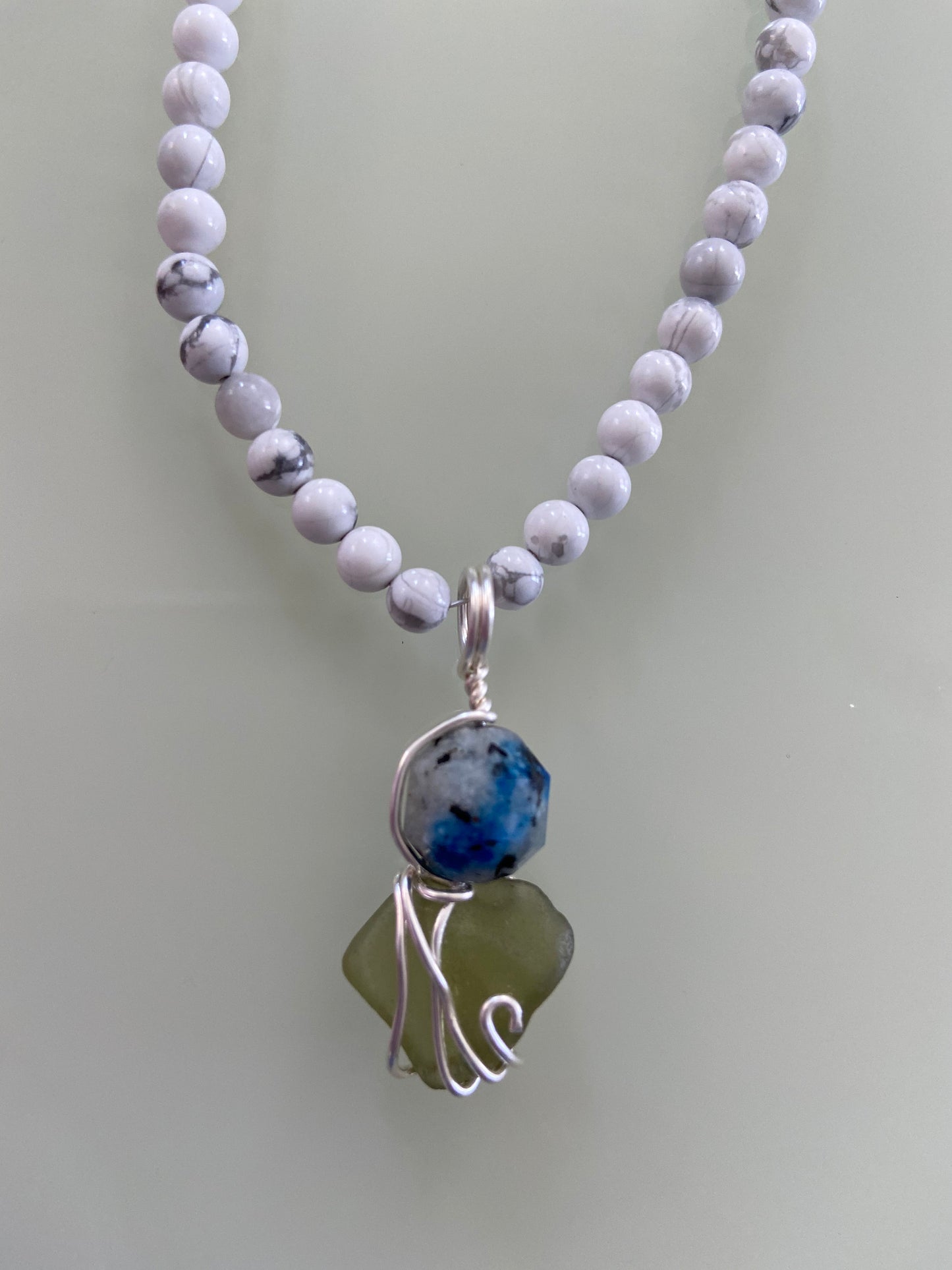 K2 crystal stone and Sea Glass intertwined in solid sterling silver to create a wonderful unique pendant with beautiful energies.