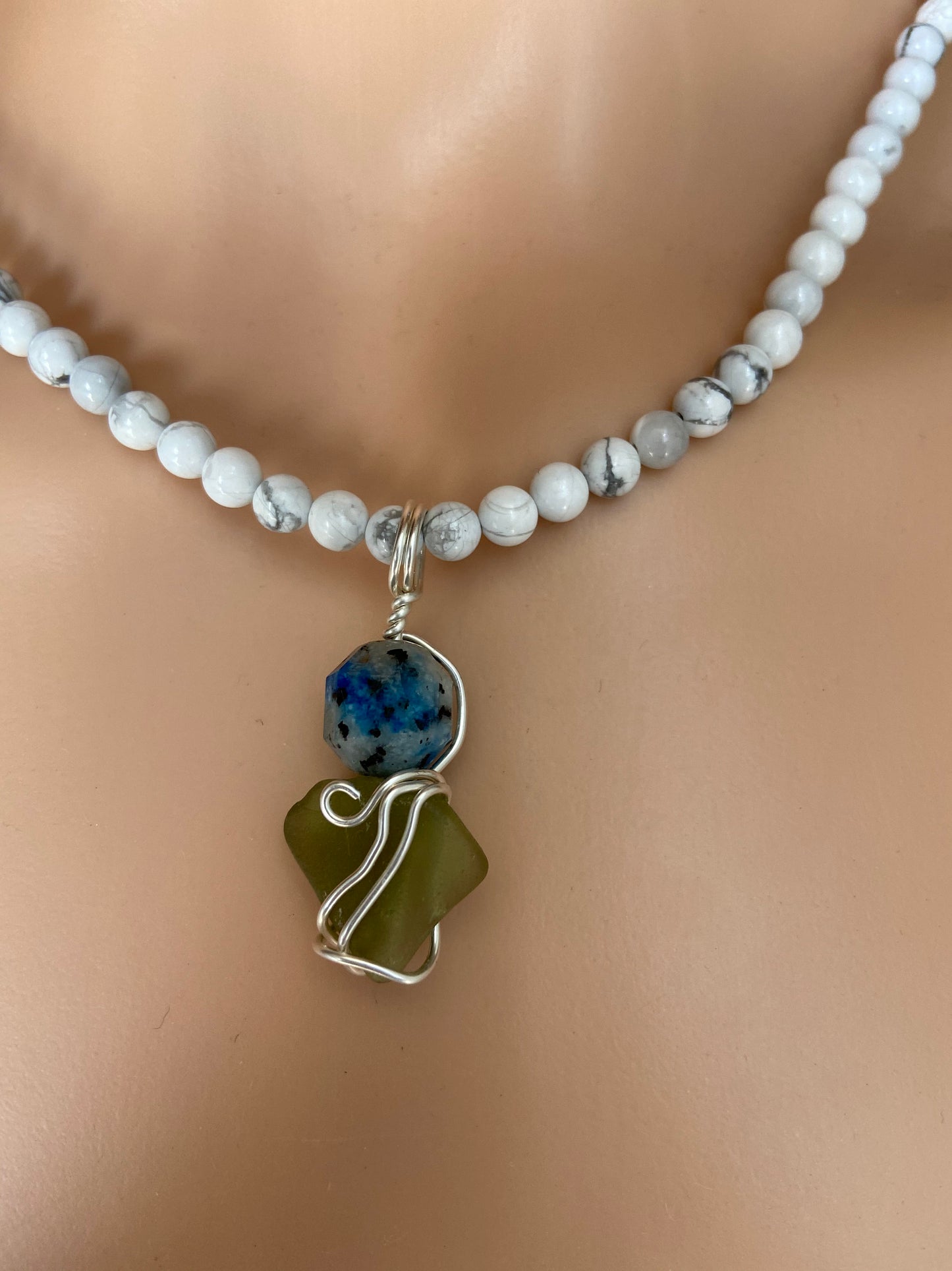K2 crystal stone and Sea Glass intertwined in solid sterling silver to create a wonderful unique pendant with beautiful energies.