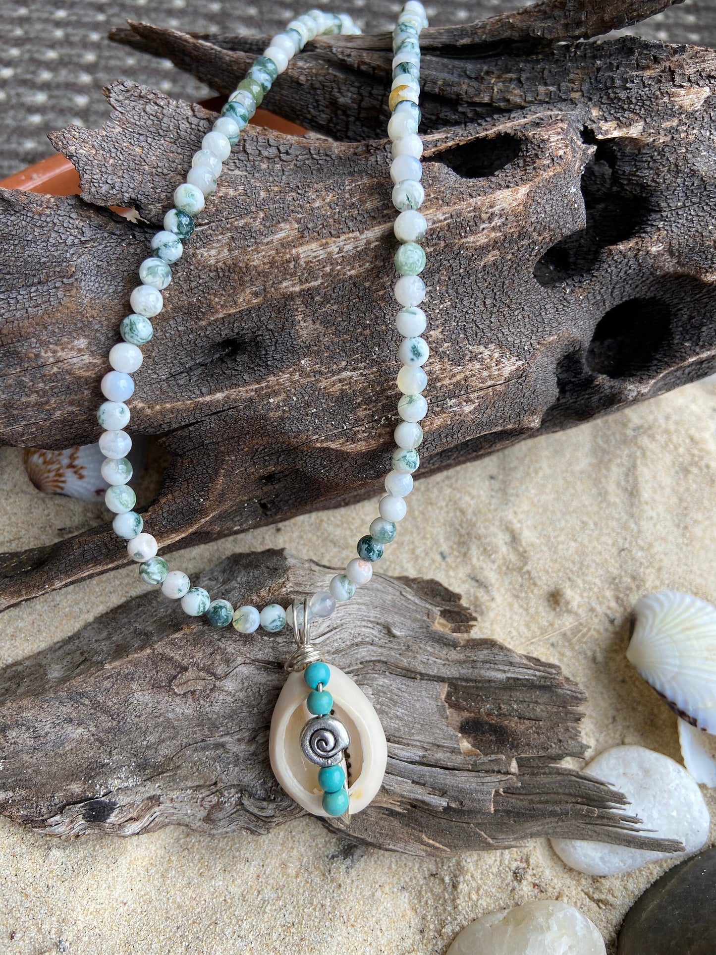 Cowrie shell  pendant wrapped in sterling silver designed with tiny turquoise coloured bead detail, Tree Agate gemstone necklace.
