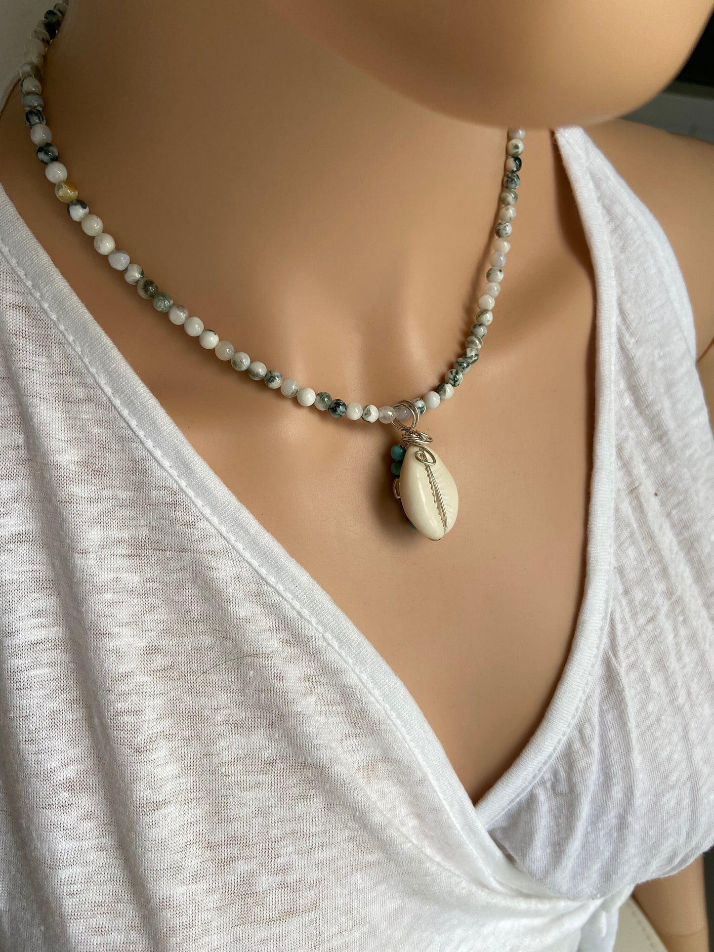Cowrie shell  pendant wrapped in sterling silver designed with tiny turquoise coloured bead detail, Tree Agate gemstone necklace.