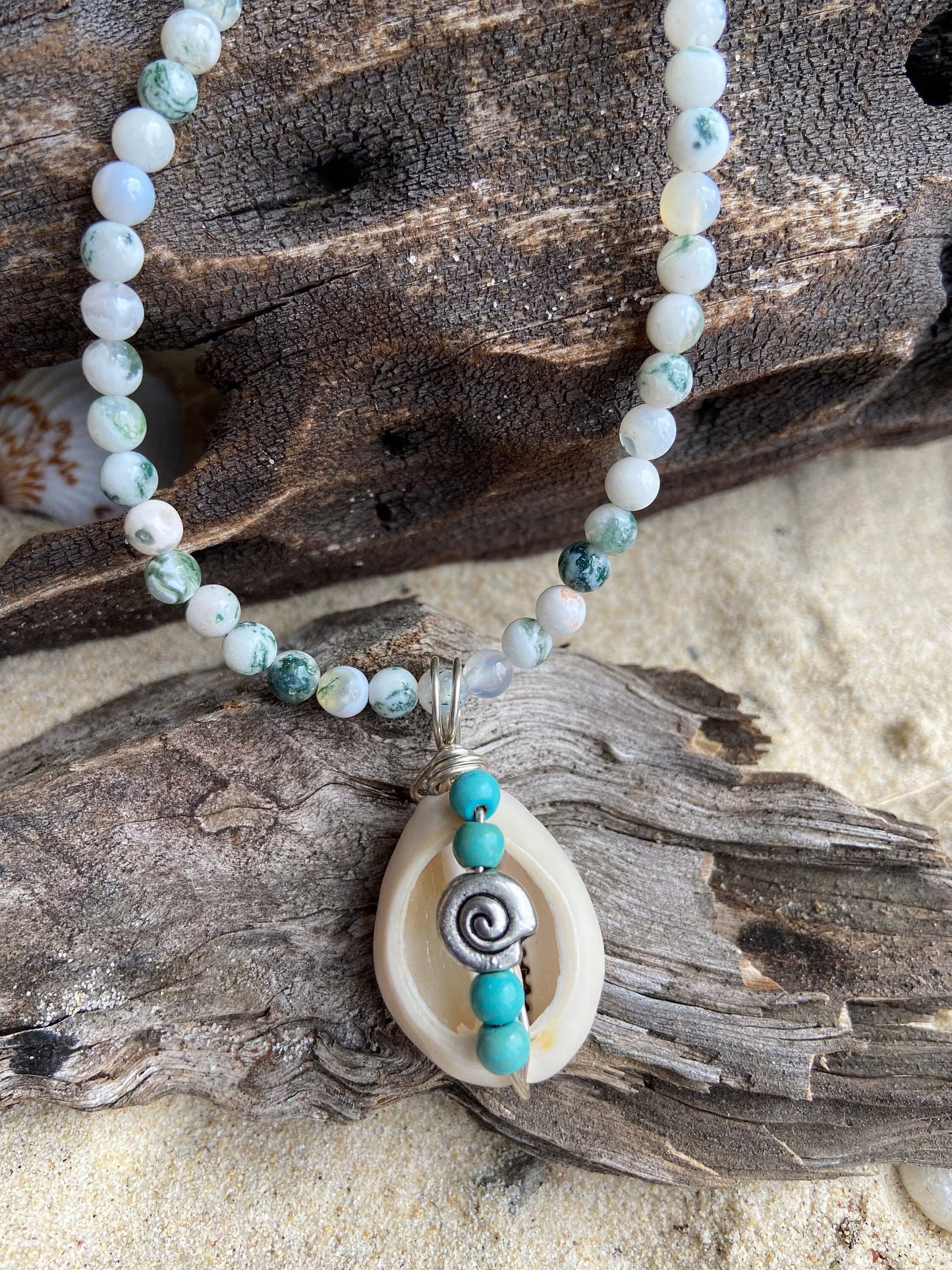 Cowrie shell  pendant wrapped in sterling silver designed with tiny turquoise coloured bead detail, Tree Agate gemstone necklace.